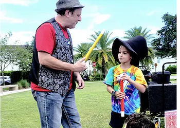 Eric performing magic at a birthday party